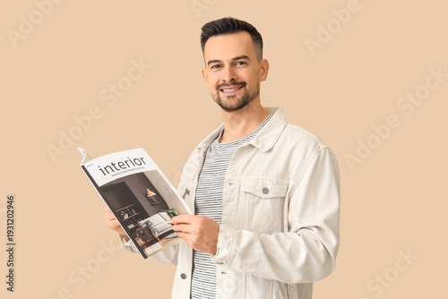 Handsome man reading magazi...