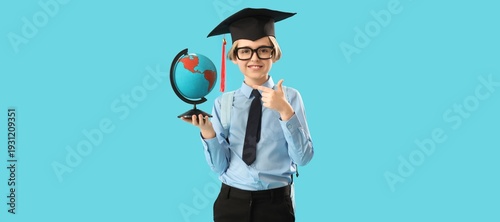 Little boy in graduation ha...