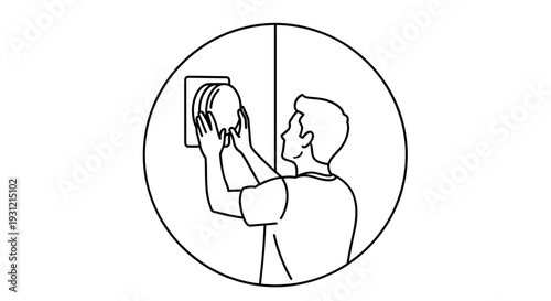Man installing a circular object onto a wall representing home improvement diy projects and interior design concepts