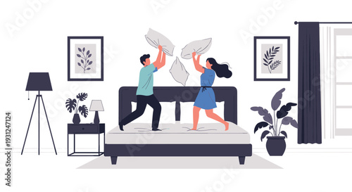 Young cheerful couple enjoying a playful pillow fight on their bed in a modern bedroom with stylish decor and plants.