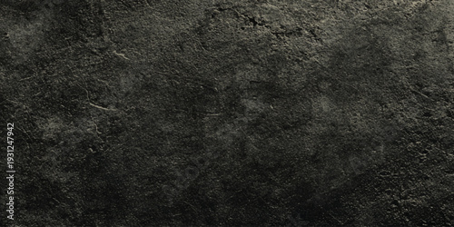 Dark concrete wall texture background with rough stone surface with natural distressed details, ideal for background.