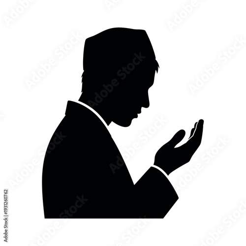 Silhouette of a Muslim man praying with hands open.