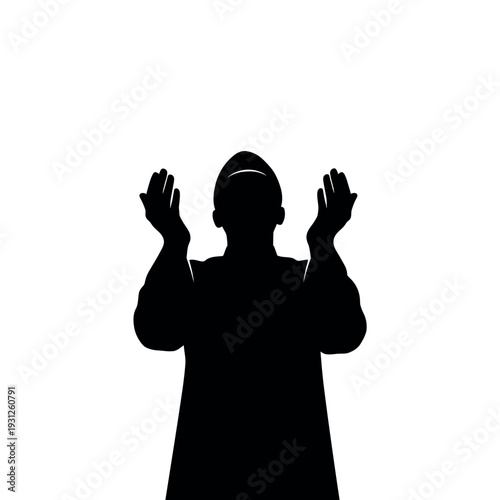 Silhouette of a person praying with hands raised to the sky.