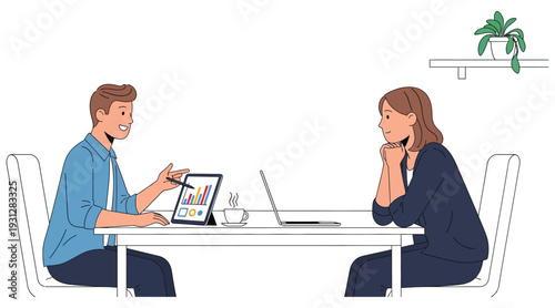 Two business colleagues engaged in a meeting with a laptop and tablet