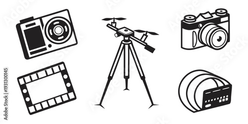 A collection of photography equipment including cameras, tripod, and film.