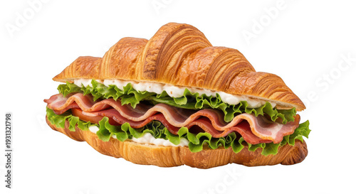 A delicious ham and lettuce croissant sandwich