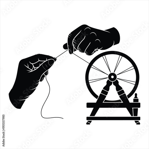 Close up of hands using antique spinning wheel to create thread in black and white