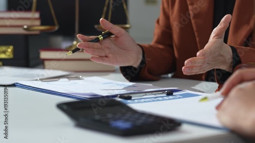Teamwork of business lawyer meeting working hard about legal legislation in courtroom to help their customer.
