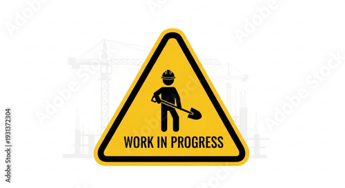 Yellow work in progress sign with construction worker and shovel