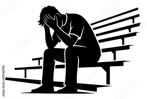 Sad fan or athlete sitting on stadium bleachers with head in hands showing defeat