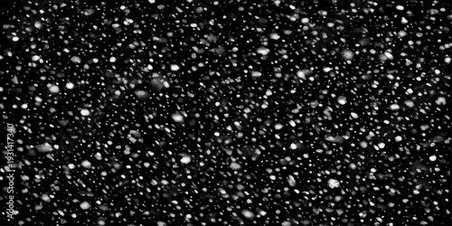 A seamless winter texture of falling snowflakes and rain drops on a black background creates a cold holiday pattern of ice and water under a dark night sky