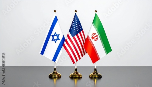 Israel, US, Iran table flags on golden bases, symbolizing diplomatic relations.