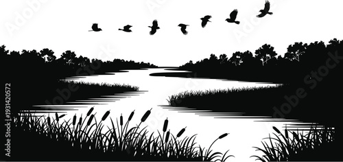 Silhouette of birds flying over a lake with reeds and trees in the background water