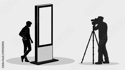 Photographer capturing a person in a photo booth setting.
