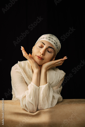 Portrait of a bald young woman with natural beauty and confident expression, isolated on neutral background. Concept of individuality, strength, self-acceptance, awareness, alopecia,