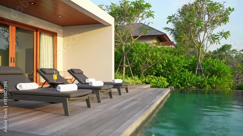 Ultra-luxury resort villa, infinity pool, lush tropical landscape. Golden hour light, reflections, unoccupied loungers, drink. Aspirational escape, deep tranquility atmosphere