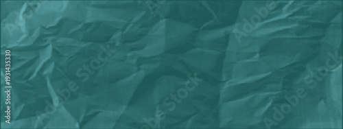 Green duotone background of crumpled paper. Grunge effect, urban, halftone overlay. Vintage wrinkled paper background. A crumpled piece, scuffs and folds. Old, damaged paper for collage, scrapbook. 