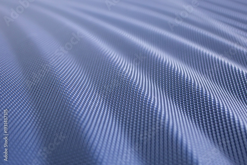 Waved carbon fiber plastic texture, surface detail close up , abstract patterned backdrop wallpaper