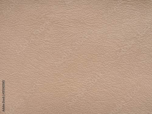 Dark beige or light brown color leather skin natural with design lines pattern or abstract background. Can use as wallpaper or backdrop luxury event. Genuine leather texture. Faux eco leather.