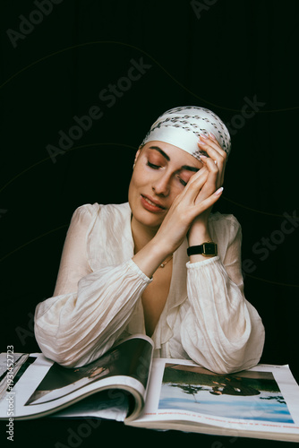 Portrait of a bald young woman with natural beauty and confident expression, isolated on neutral background. Concept of individuality, strength, self-acceptance, oncology awareness, alopecia