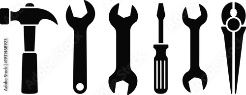 Set of black and white hand tools including hammer wrench pliers and screwdriver