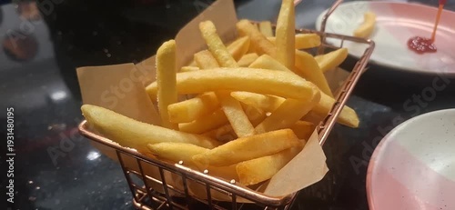 Crispy golden French fries made from fresh potatoes, deep fried to perfection, crunchy outside, soft inside, served hot with delicious dips