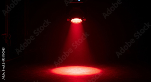 Bright Red Spotlight Illuminating Dark Stage.