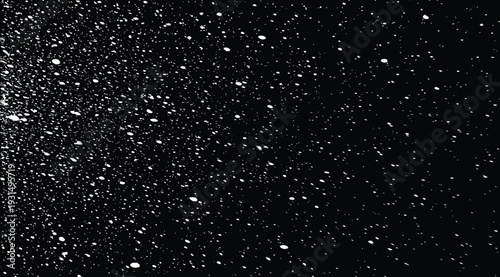 Black background with white specks and particles scattered throughout the space