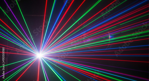 Colorful laser light beams radiating from a bright central point.