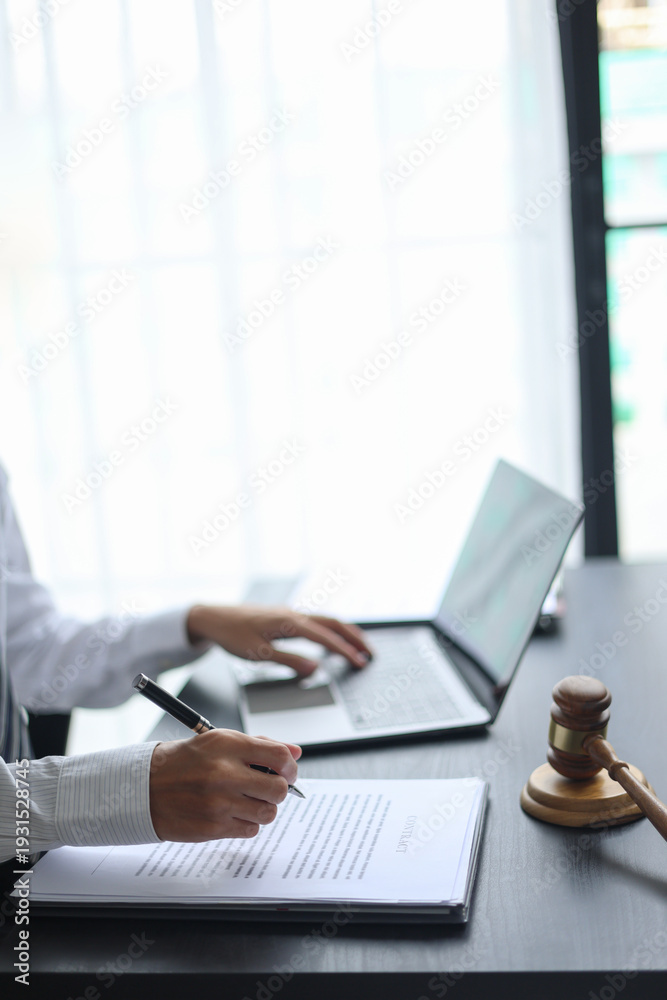 Fototapeta premium Lawyer Reviewing Contract with Gavel on Desk.