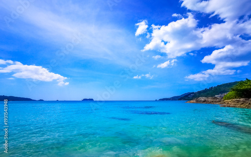 Patong Kamala Beach tropical panorama rocks sea palms Phuket Thailand.