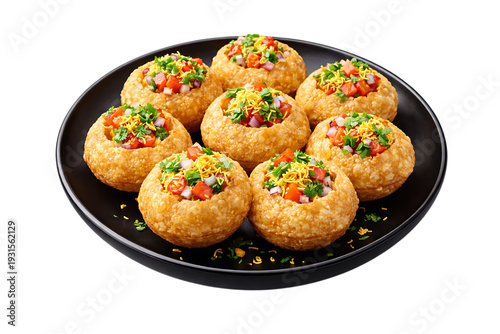 Delicious panipuri chaat served on a black plate garnished with fresh vegetables and spices on transparent background