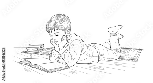 Little boy lying on floor reading book at home