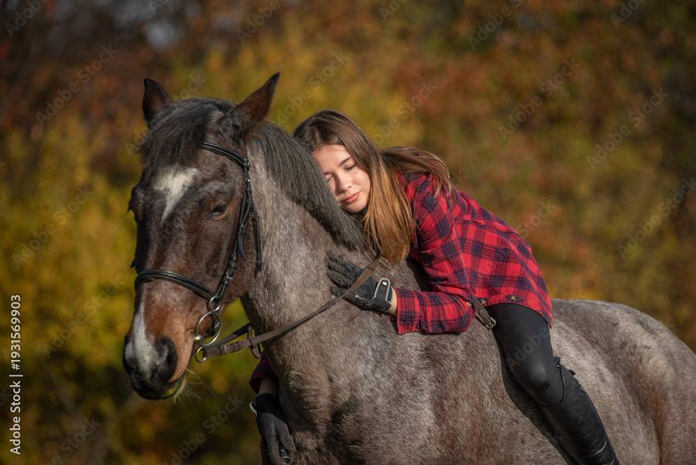Fototapeta premium portrait of a girl with a horse