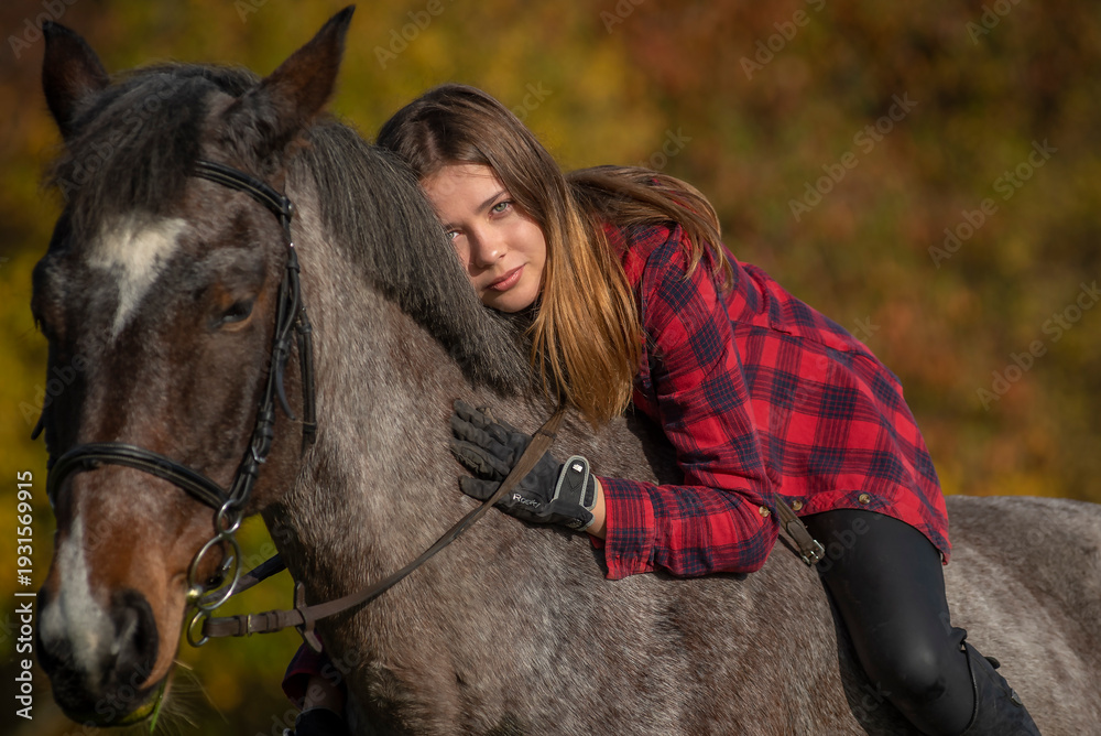 Fototapeta premium portrait of a girl with a horse