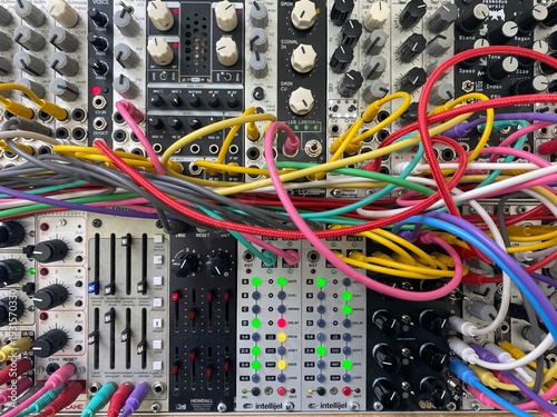 modular music synthesizer eurorack system with colorful patch cables