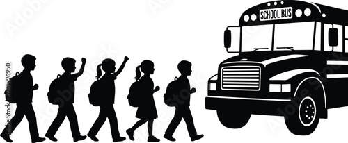 Silhouette of elementary school children with backpacks walking in a line to board a yellow school bus for morning transport and education