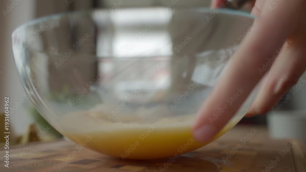 custom made wallpaper toronto digitalHands whisk beaten eggs in glass bowl on wooden kitchen counter with cracked eggshells. Person preparing breakfast. Concept of home cooking food preparation and recipe ingredients.