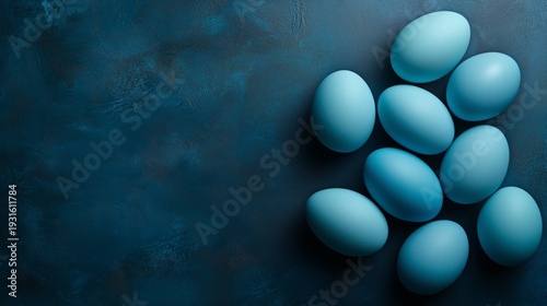 Colorful Blue Eggs Arranged on a Dark Surface for Decoration or Celebration