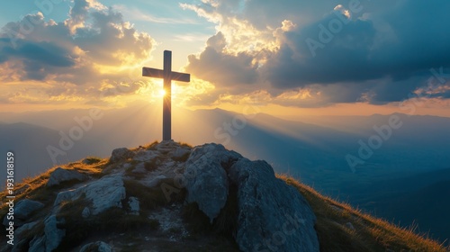 Sunrise Over a Cross on a Hill With Clouds and Rays of Light in the Background