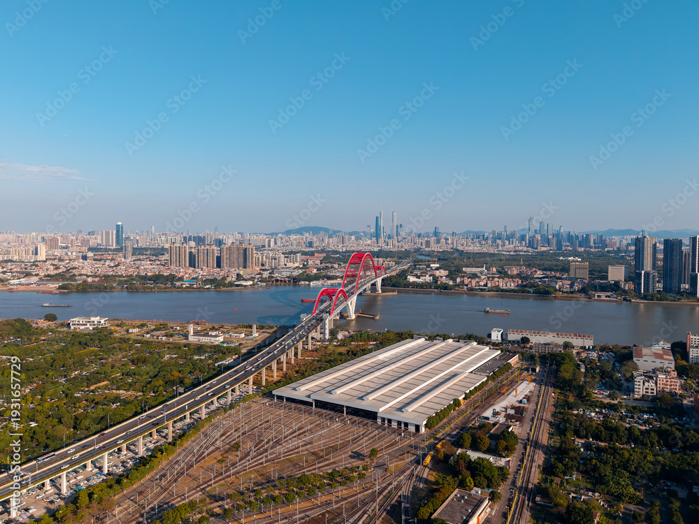 Fototapeta premium Aerial view of Guangzhou: liede bridge, cityscape, urban skyline with metro station, blue sky, pearl river