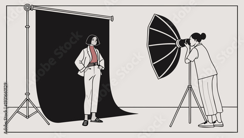 Professional studio photoshoot with a female model and photographer.