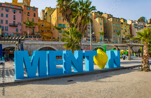 Giant city name in capital letters on the beach, lemon instead of the letter O, Menton, French Riviera , France