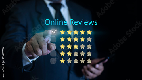 Customer review satisfaction feedback survey concept. Businessman using smartphone to give five-star positive review. Online ratings and excellent service.
