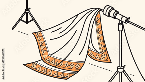 Photography studio setup with a blanket draped over a light stand ready for a photoshoot.