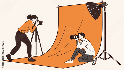 Two photographers capturing images in a professional studio setting.