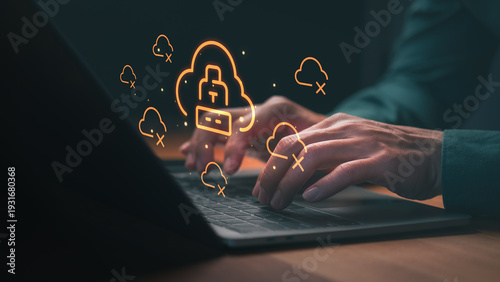 Hands typing on a laptop with cloud computing and cybersecurity icons for data protection, network security, and privacy. Essential technology for online safety and cloud storage.
