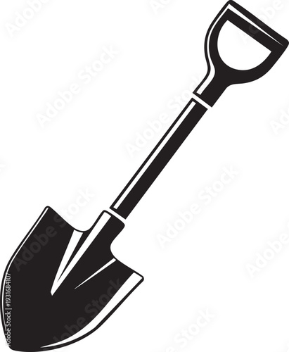 A shovel lies on the ground in a garden or construction site outdoors.