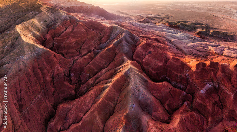 Fototapeta premium Colorful layered sedimentary mountain and sandstone texture pattern in Altyn Emel, Kazakhstan