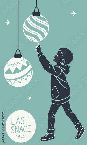 Little boy playing with Christmas ornaments celebrating the holiday season.